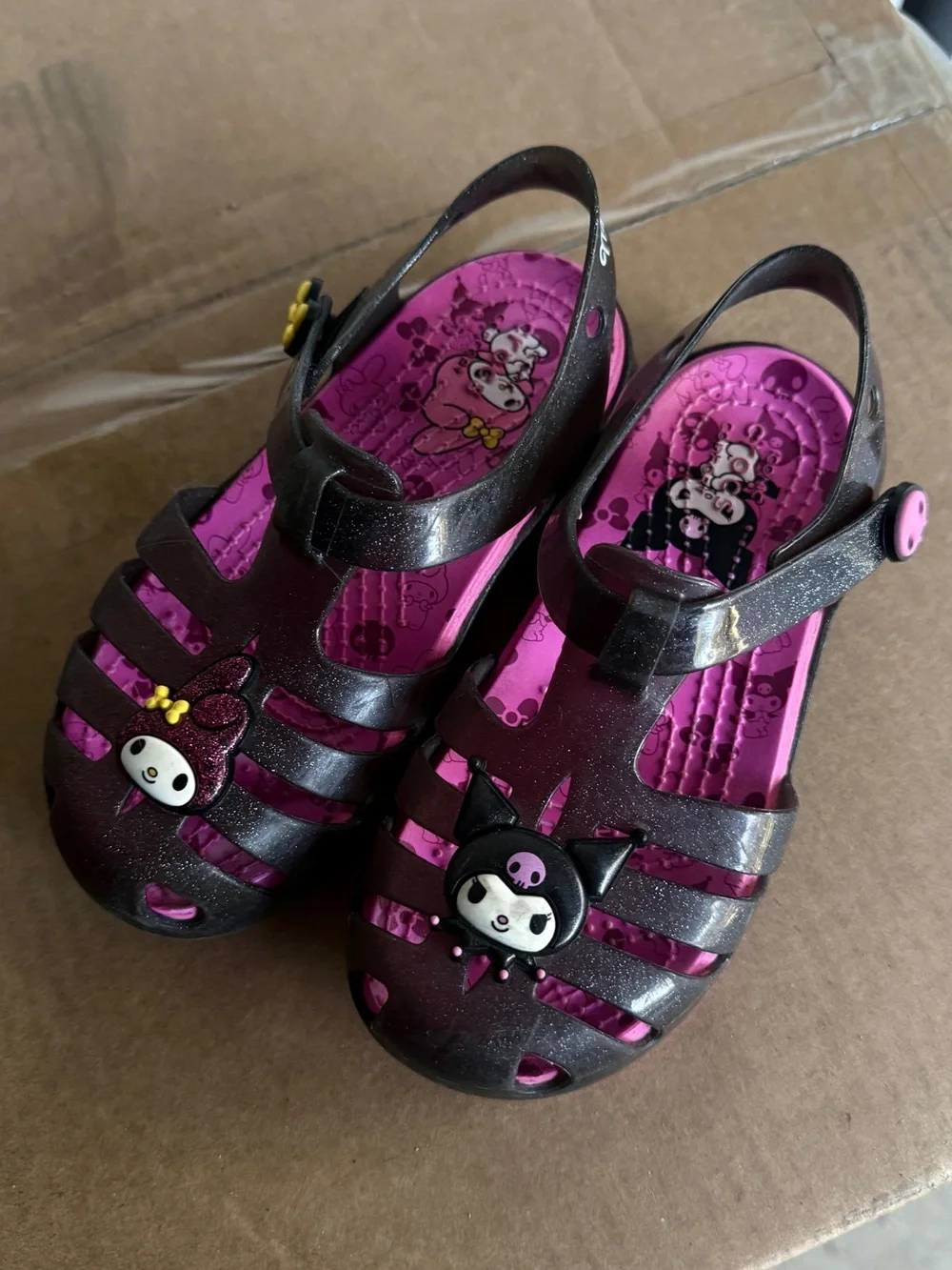 CROCS Girls' Pink and Black Glitter Jellies with Character Charms
